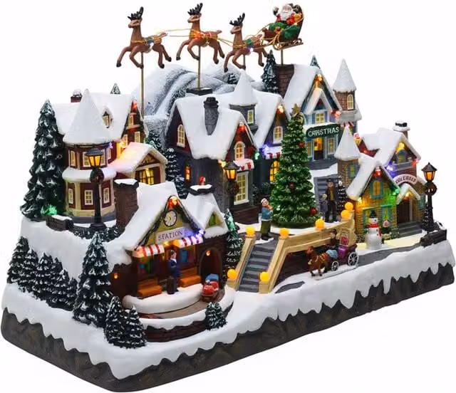 Villaggio di Natale Luminoso Saint Joy con Musica, Luci LED Multicolore, Slitta con Renne, Trenino e Albero Rotante, L/P/H: 55 x 32,5 x 37 cm